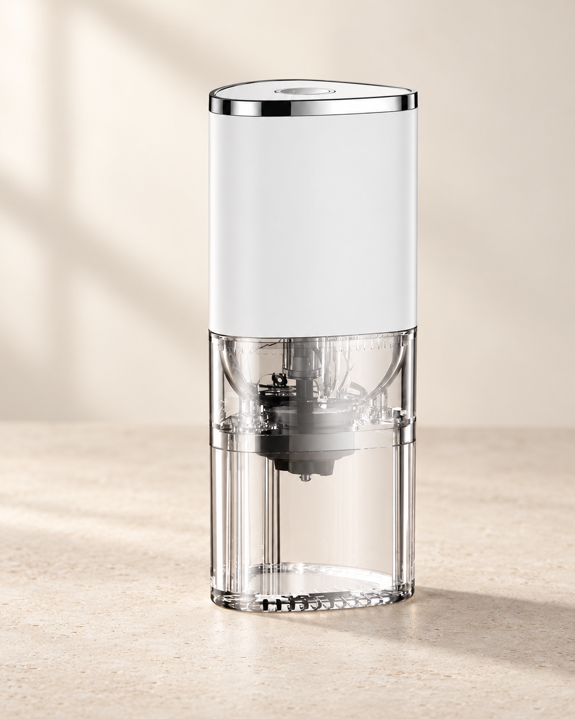 White rechargeable coffee grinder with a chrome rim and clear plastic hopper and grounds chamber.